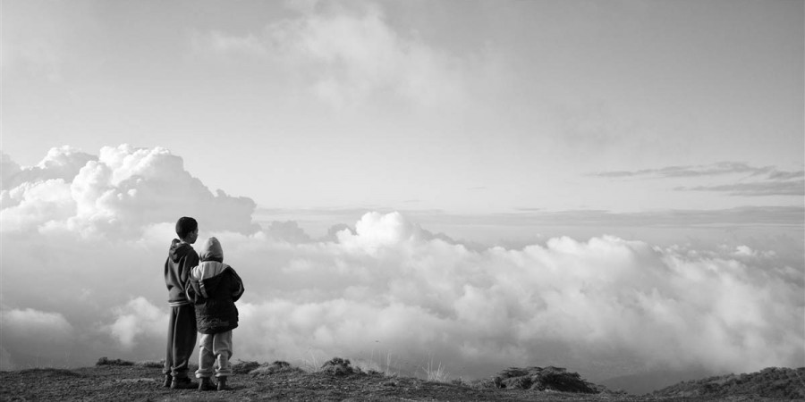 Two brothers stand on the top of the mountain and look into the future. ©Jamel Eddine