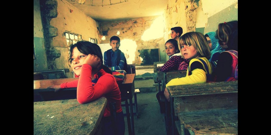 Life goes on for these children in the Aleppo suburb despite the cold and the destruction. They continue to receive education, even though their school has been bombed several times. ©Catherine Ward