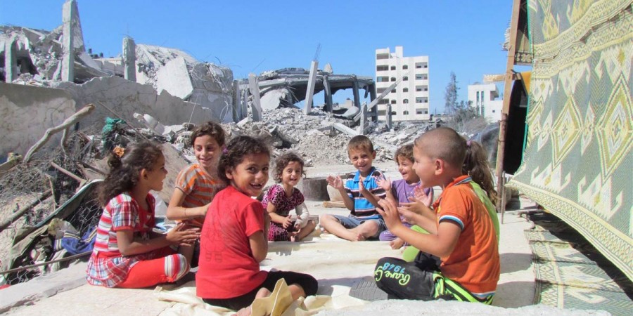 A group of children play outside their destroyed house in the Al Zaytoun area in Gaza City. ©Mustafa El Halabi